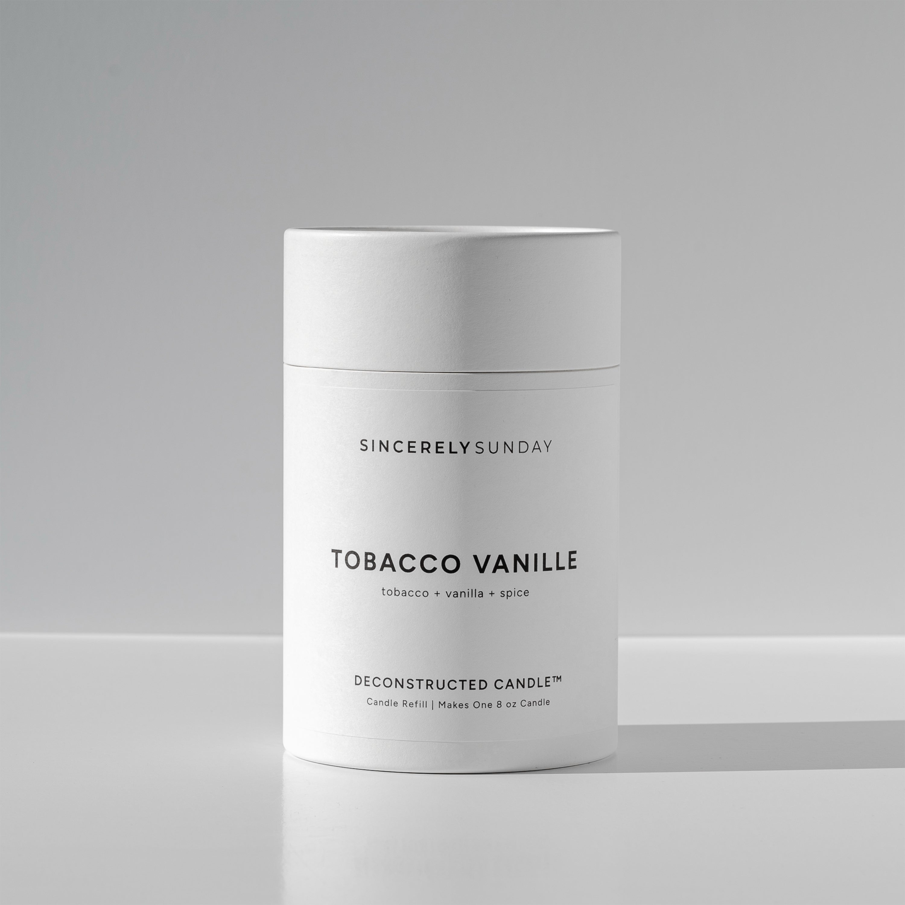 White cylindrical paper tube labeled 'Tobacco Vanille' by Sincerely Sunday on a white background