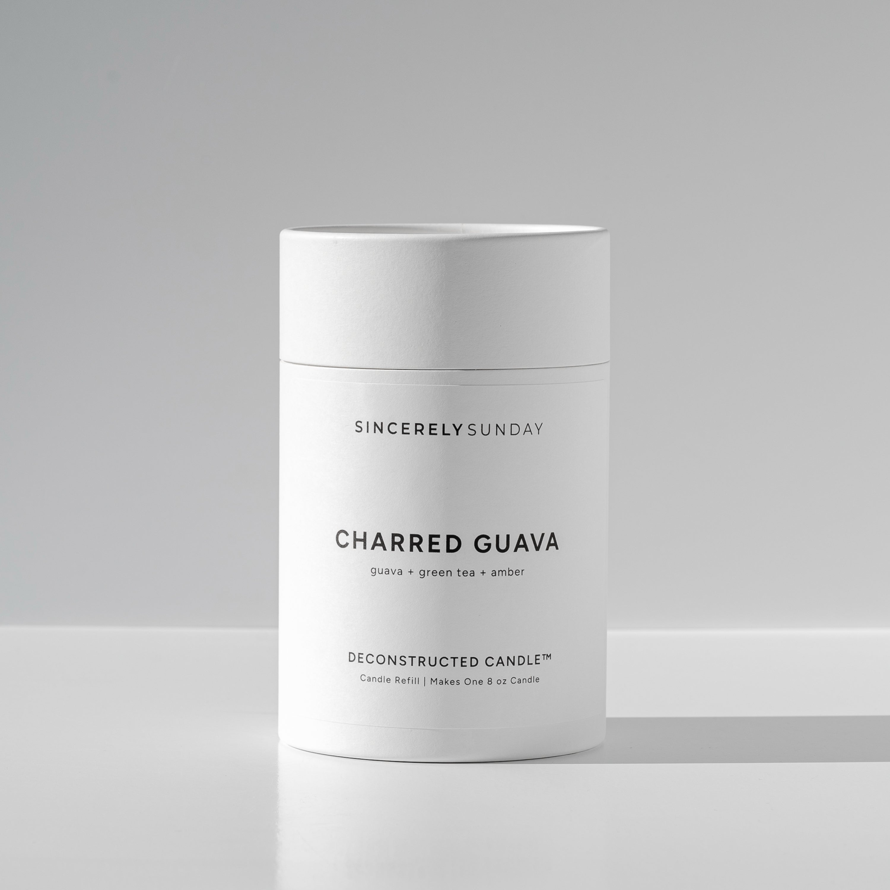 White cylindrical paper tube labeled 'Charred Guava' by Sincerely Sunday on a white background