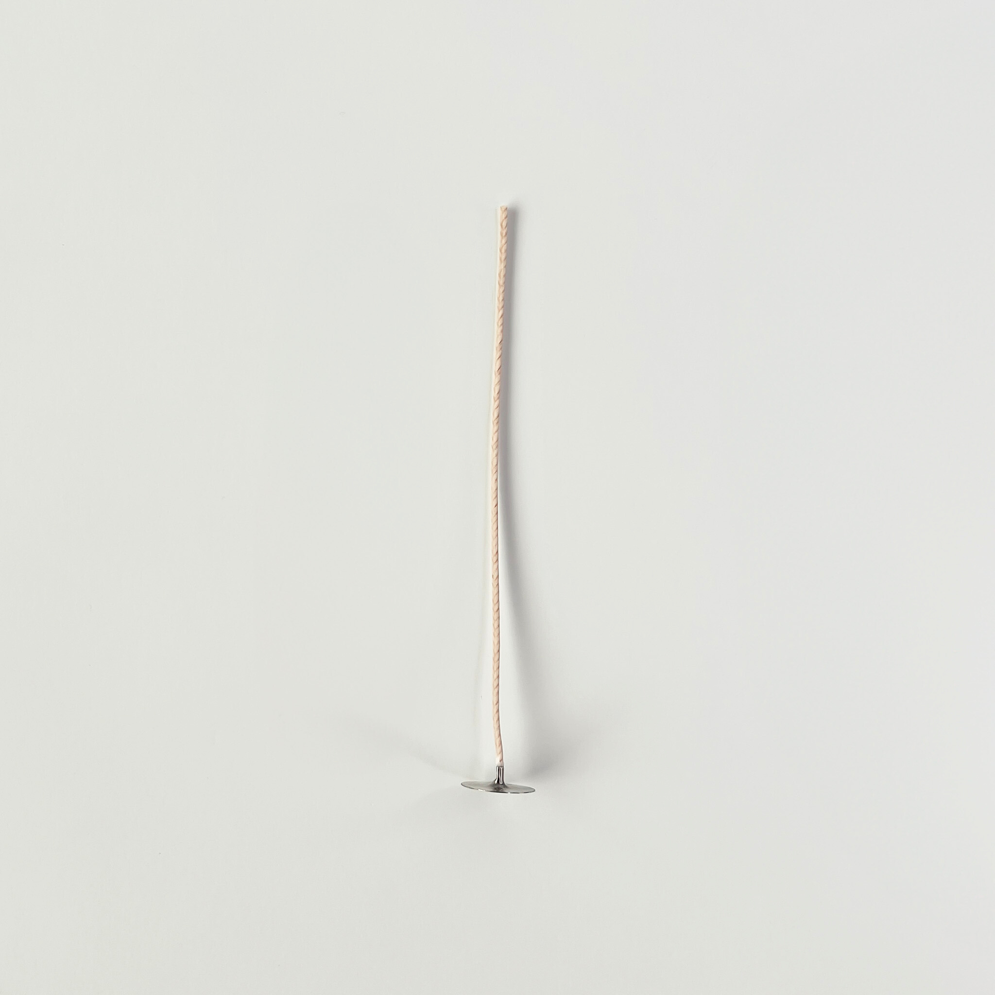 cotton wick on a light gray background