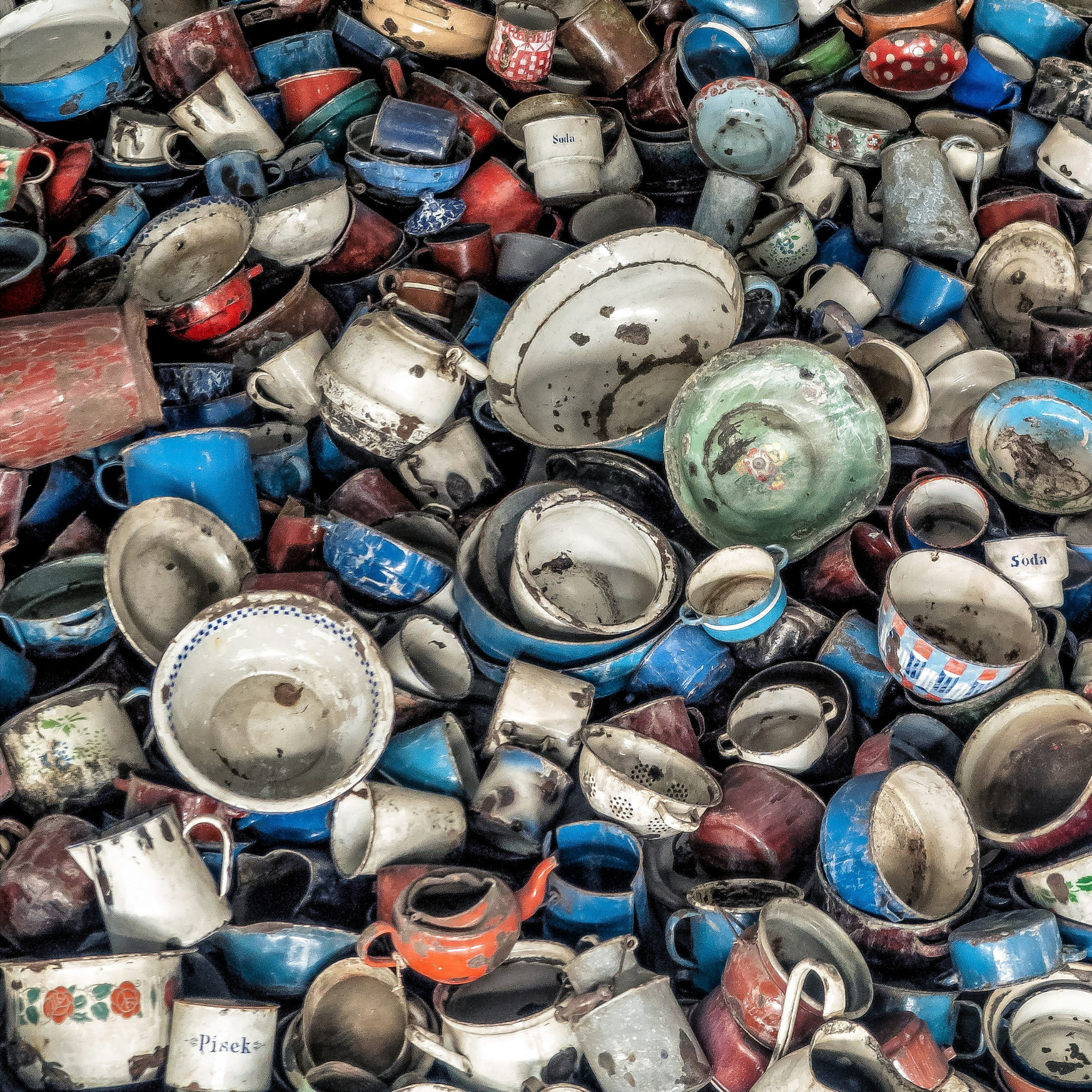 Pile of assorted ceramic vessels in a landfill